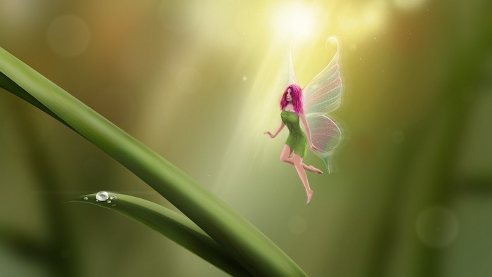 Fairy with pink hair on a blade of grass