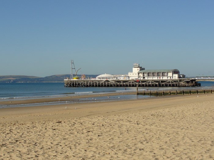 Bournemouth Pier and beach on a clear day