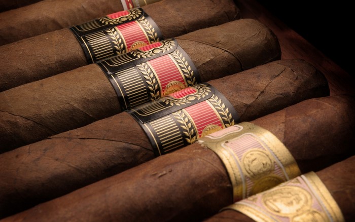 Close-up of cigars with bands