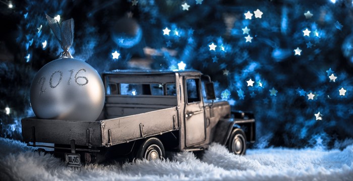 Toy truck carrying a 2016 Christmas ornament