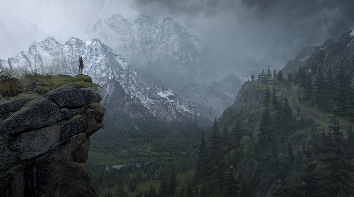 Lara Croft on a cliff overlooking mountains in Rise of the Tomb Raider