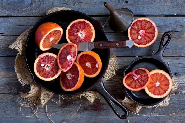 Blood oranges sliced in cast iron pans