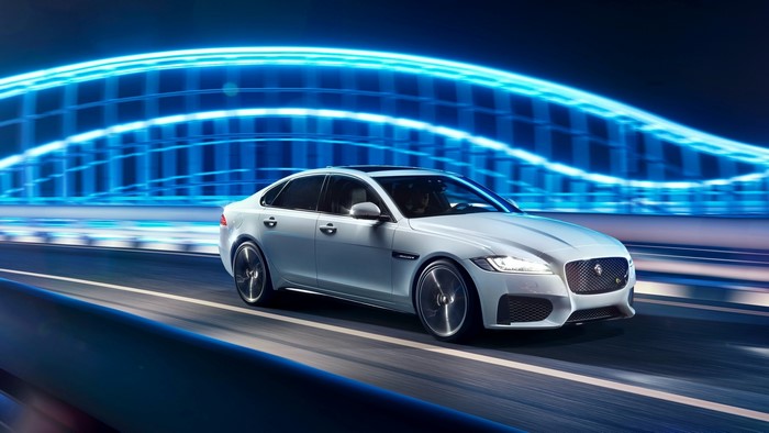White Jaguar XF S AWD in motion