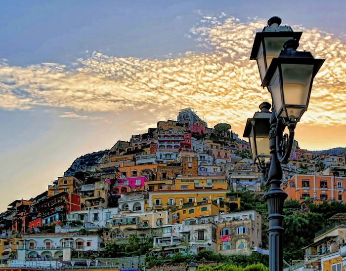 Positano, Italy houses on a hillside with street lights