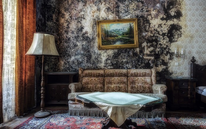 Retro living room with sofa, table, and lamp
