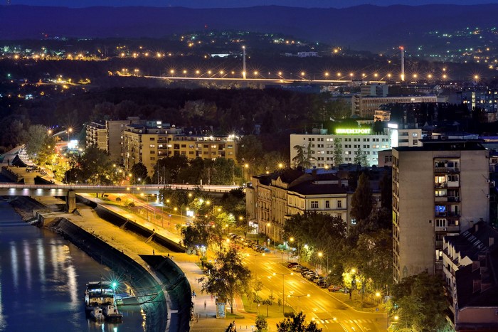 Novi Sad at night with bridge and river