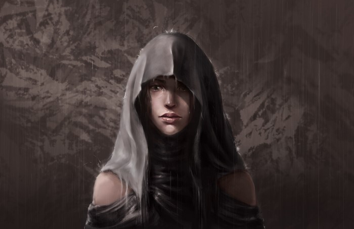 A person in a hooded cloak in the rain
