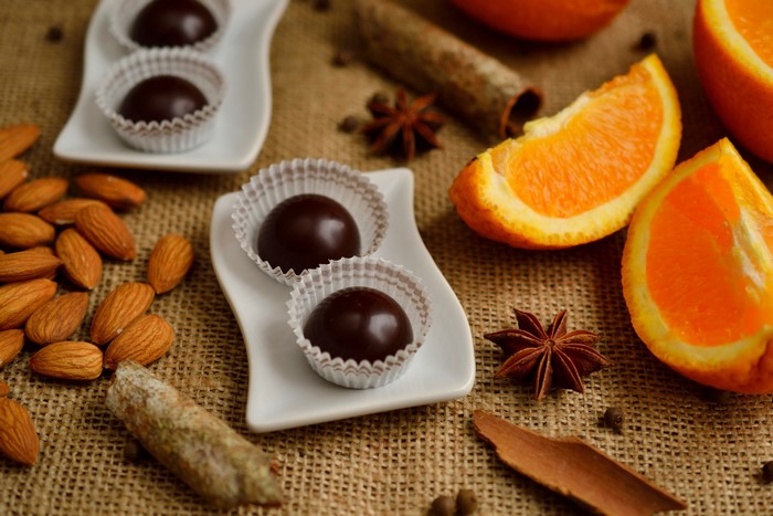 Chocolate candies with almonds and oranges