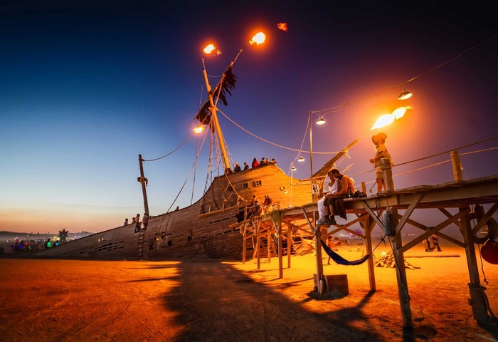 Burning Man pirate ship installation at night