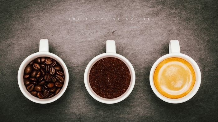 Three cups of coffee: beans, grounds, and espresso