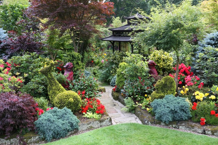 Japanese garden with topiary and statues
