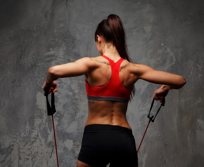 Woman exercising with resistance band