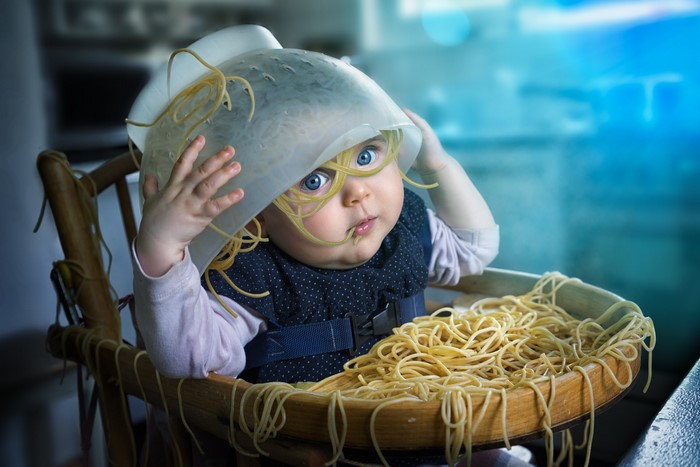 Baby with spaghetti on head