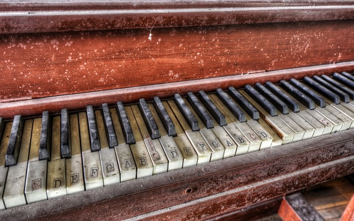 Close-up of an old, dusty piano keyboard