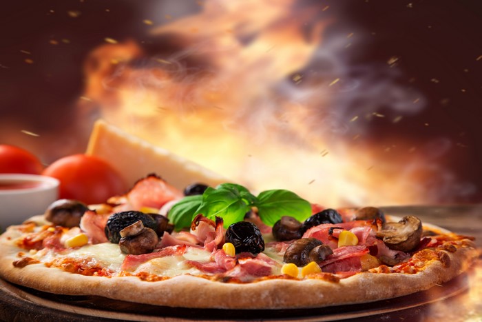 Pizza with mushrooms, olives, and ham