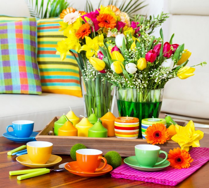 Colorful Spring Flowers and Candles on a Table