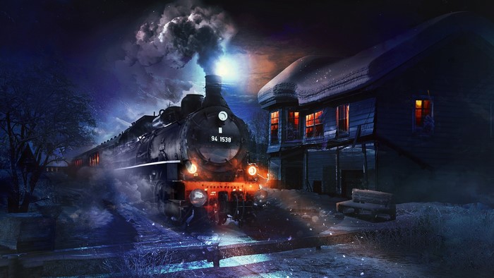 Steam train at night near a snowy house