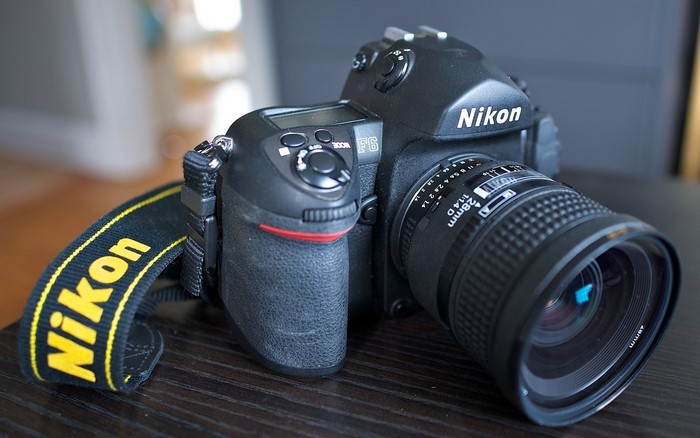 Nikon F6 camera with 28mm lens and strap