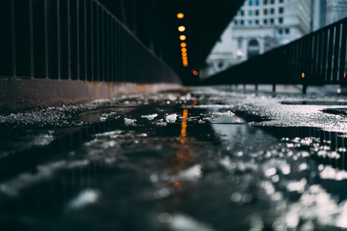 Chicago street with puddles and lights
