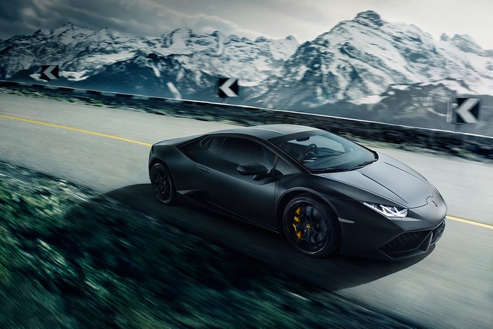 Black Lamborghini Huracan LP640-4 driving on a mountain road