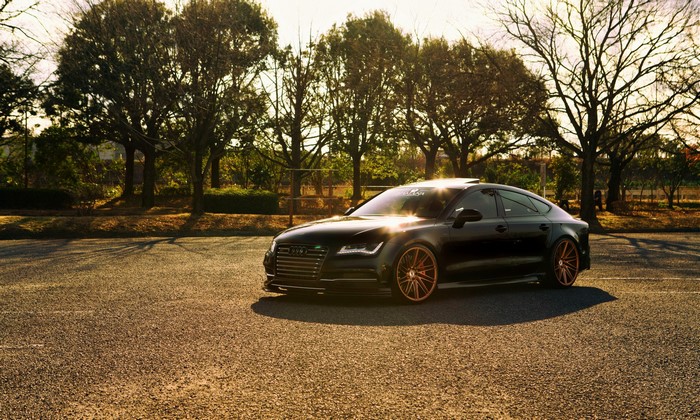 Black Audi A7 parked on asphalt road