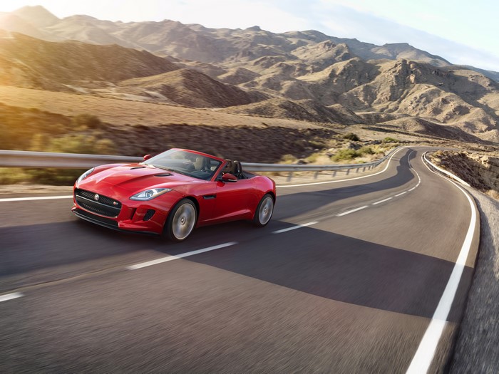 Red 2016 Jaguar F-Type S convertible on a mountain road