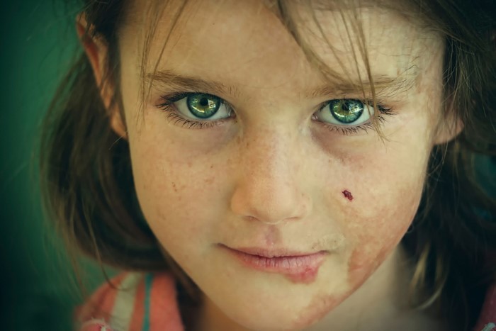 Portrait of a Young Girl with Striking Green Eyes