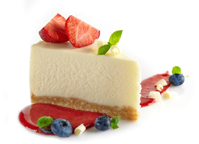 Cheesecake slice with strawberries and blueberries