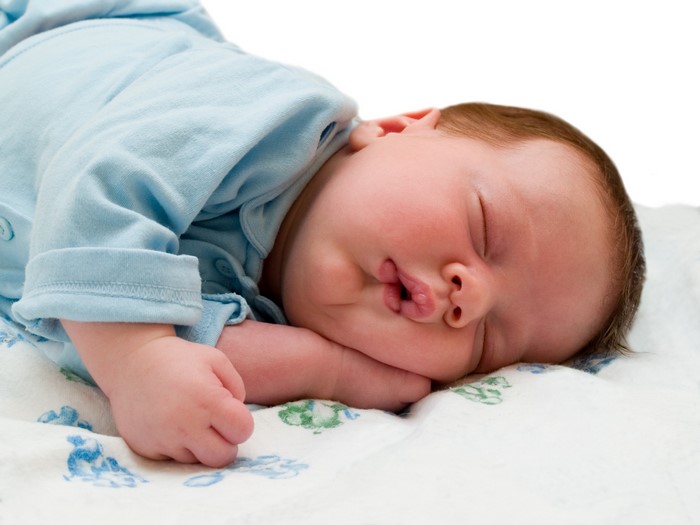 Baby sleeping on a blanket