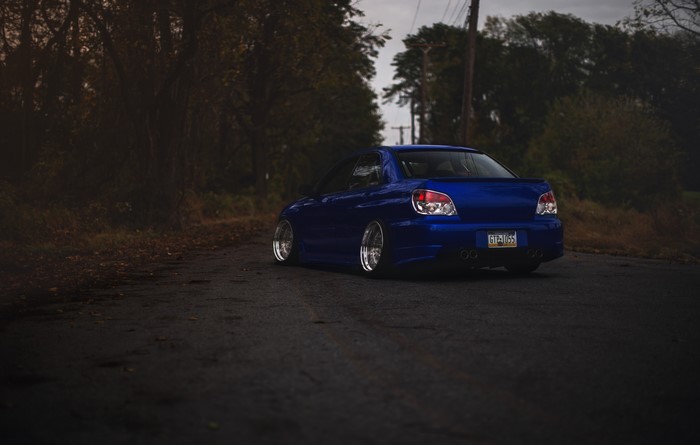 Blue Subaru Impreza WRX STI on a Road