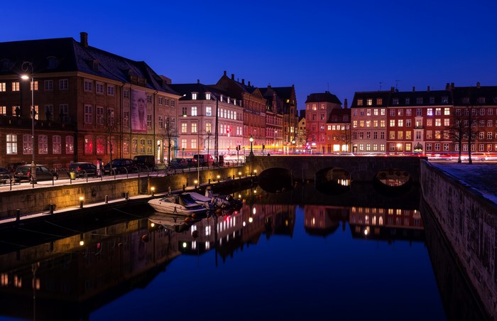 Copenhagen Canal at Night with Illuminated Buildings and Bridge