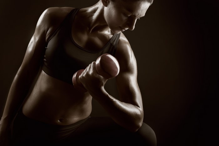 Woman exercising with dumbbells