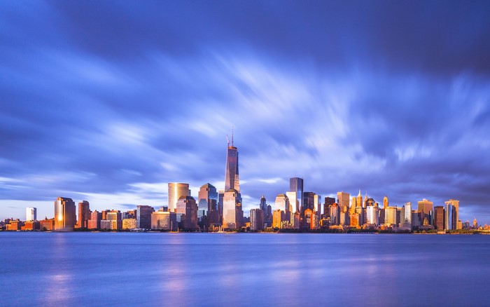 New York City skyline at dusk over water