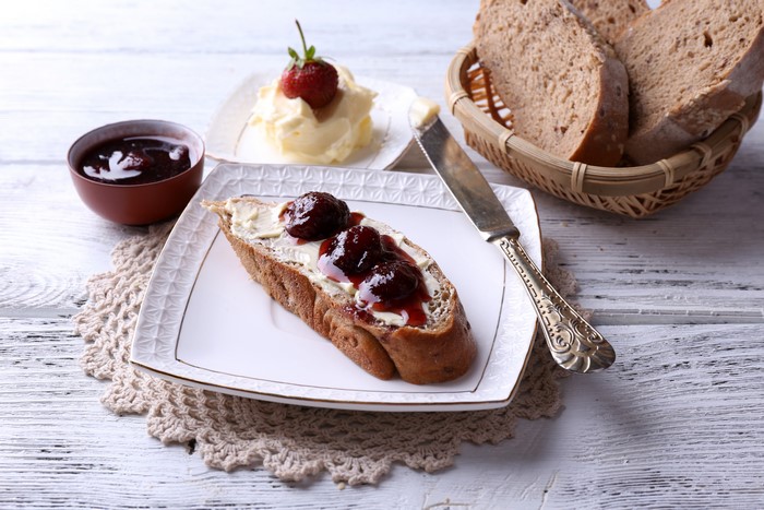 Bread with butter and jam on a plate