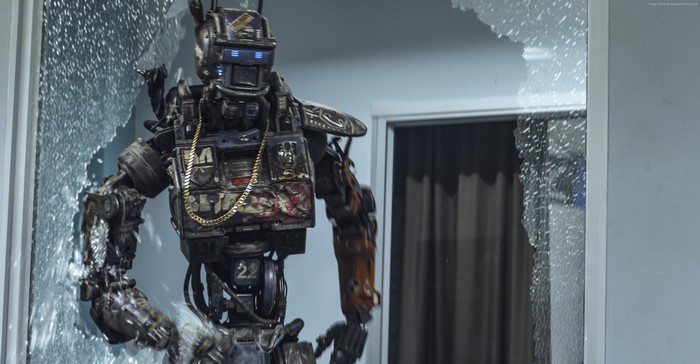 Chappie from Chappie breaks through a window