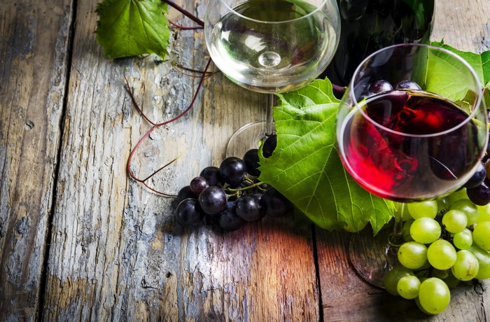 Wine and Grapes on a Wooden Table
