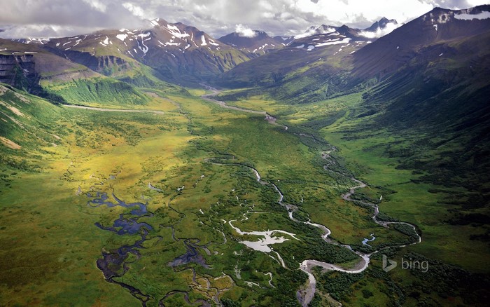 Aerial view of a winding river valley in Alaska