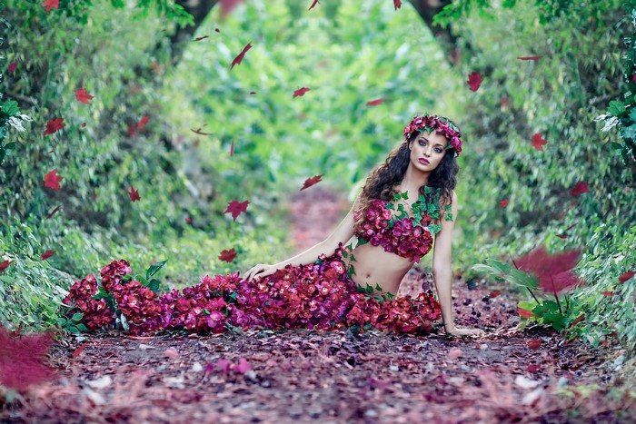 Woman dressed as a flower mermaid in a forest