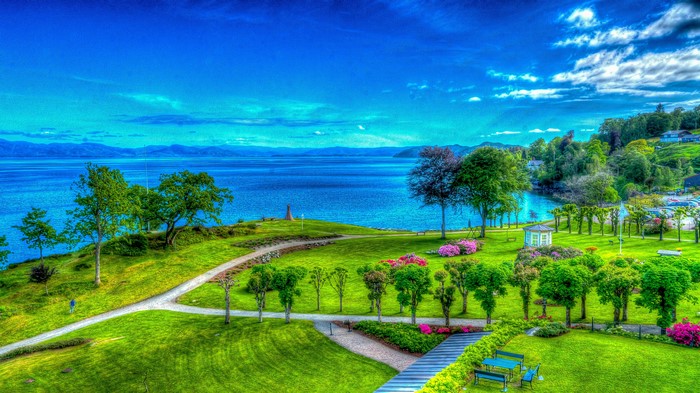 Park with lake and distant mountains