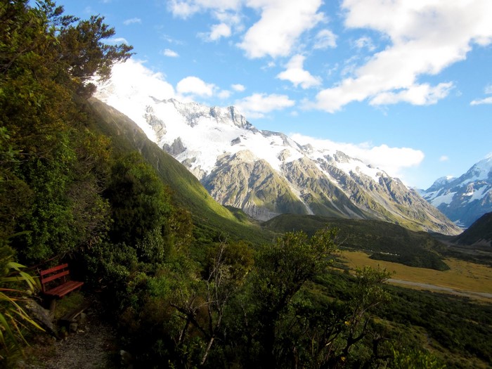 Bench overlooking snowy mountains in Mount Cook National Park, New Zealand