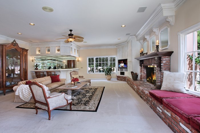 Living room with bar, fireplace, and seating area