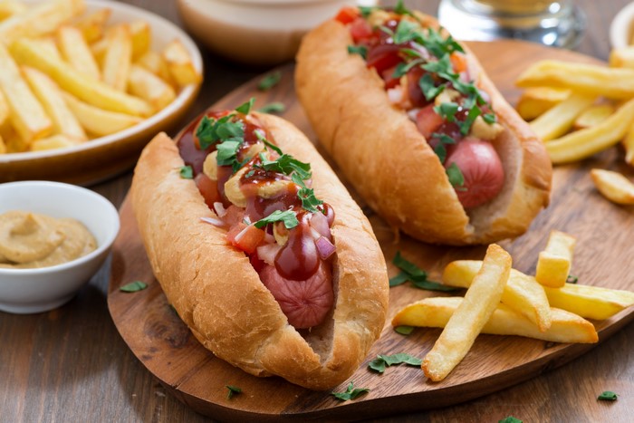 Hot dogs with french fries and mustard