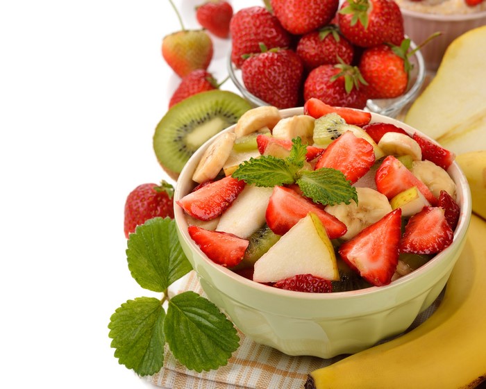 Fruit salad with strawberries, kiwi, banana, and pear