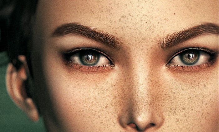 Close-up of a woman's eyes and nose with freckles
