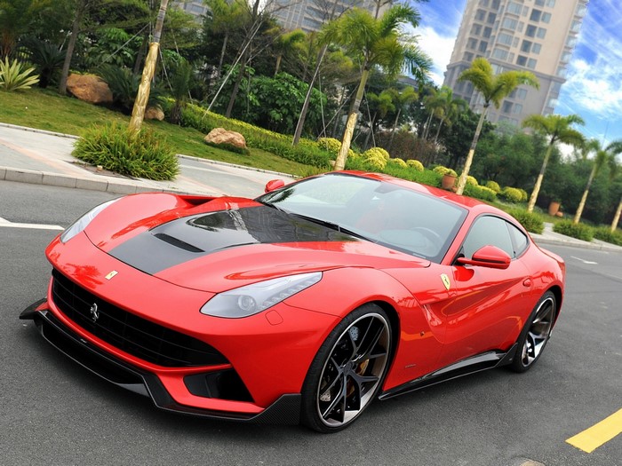 Red DMC F12 Berlinetta Ferrari parked on a street
