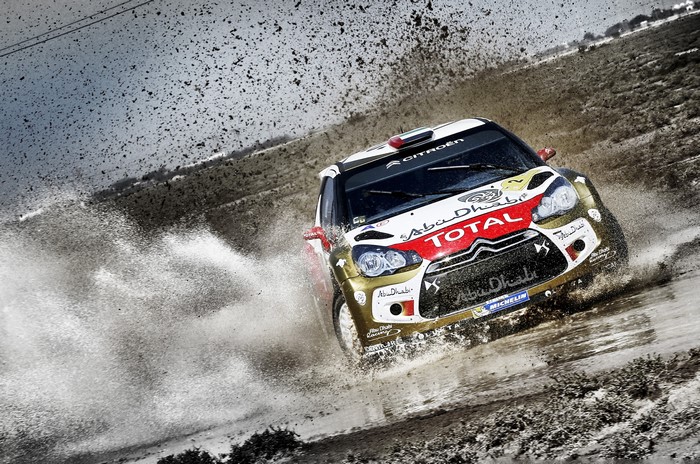 Citroen DS3 WRC car driving through mud