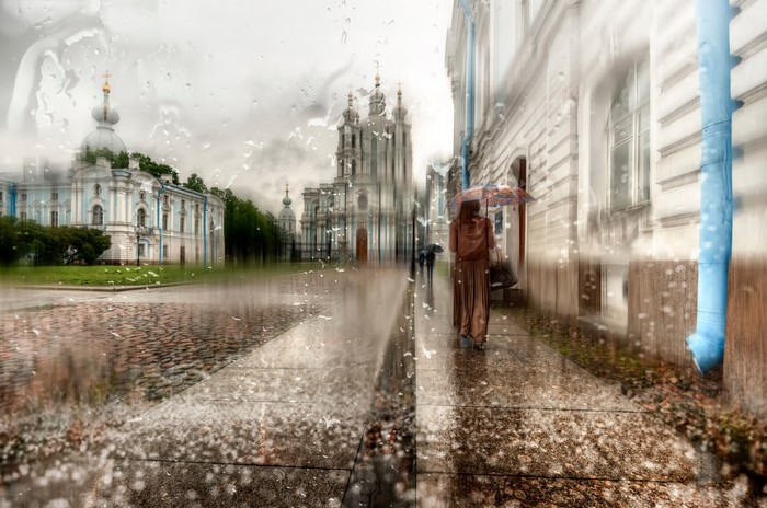Rainy day in St. Petersburg with people holding umbrellas