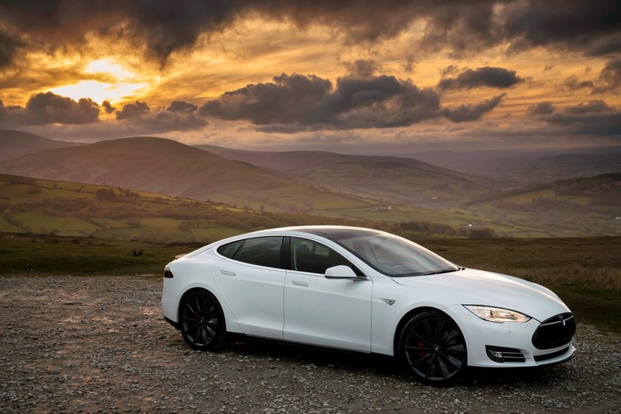 White Tesla Model S P85 at Sunset in Mountains