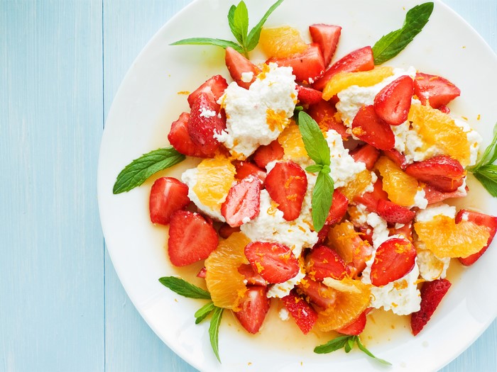 Fruit salad with strawberries, oranges, and cottage cheese