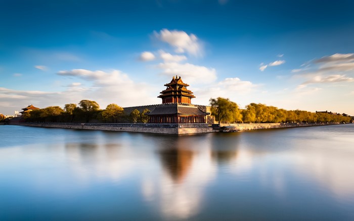 Corner tower of the Forbidden City reflected in water